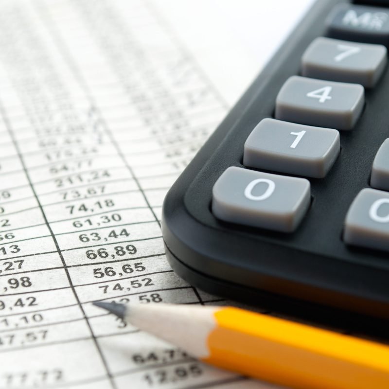 calculator and stationery items on the table